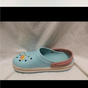 Pink and blue crocs. Comes with gibbets in the photos.